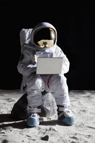 Astronaut-looking at laptop