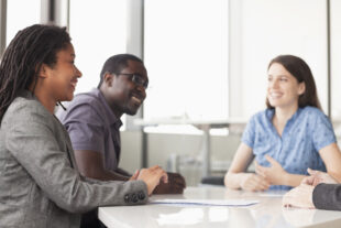 Smiling people at a team meeting