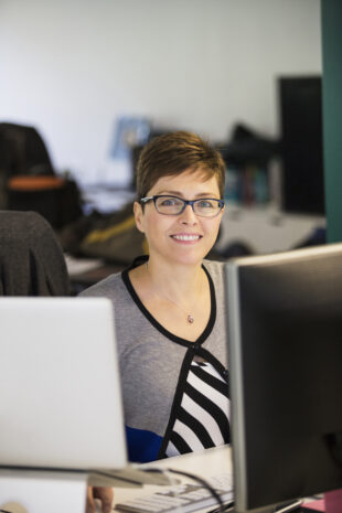 Female office worker smiling