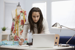 Female clothes designer working in a workshop