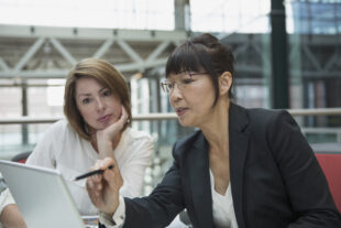 Businesswomen using a laptop