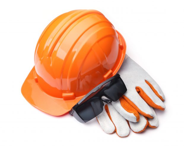 protective work-wear, orange hard hat, safety glasses and leather gloves on a white background